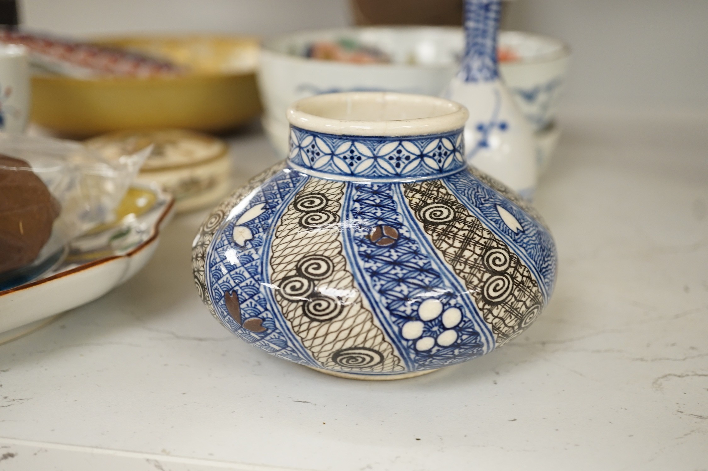 A group of 19th/20th century Japanese ceramics, Including five dishes, three vases, a cup, a Satsuma box and cover and a model of a dog